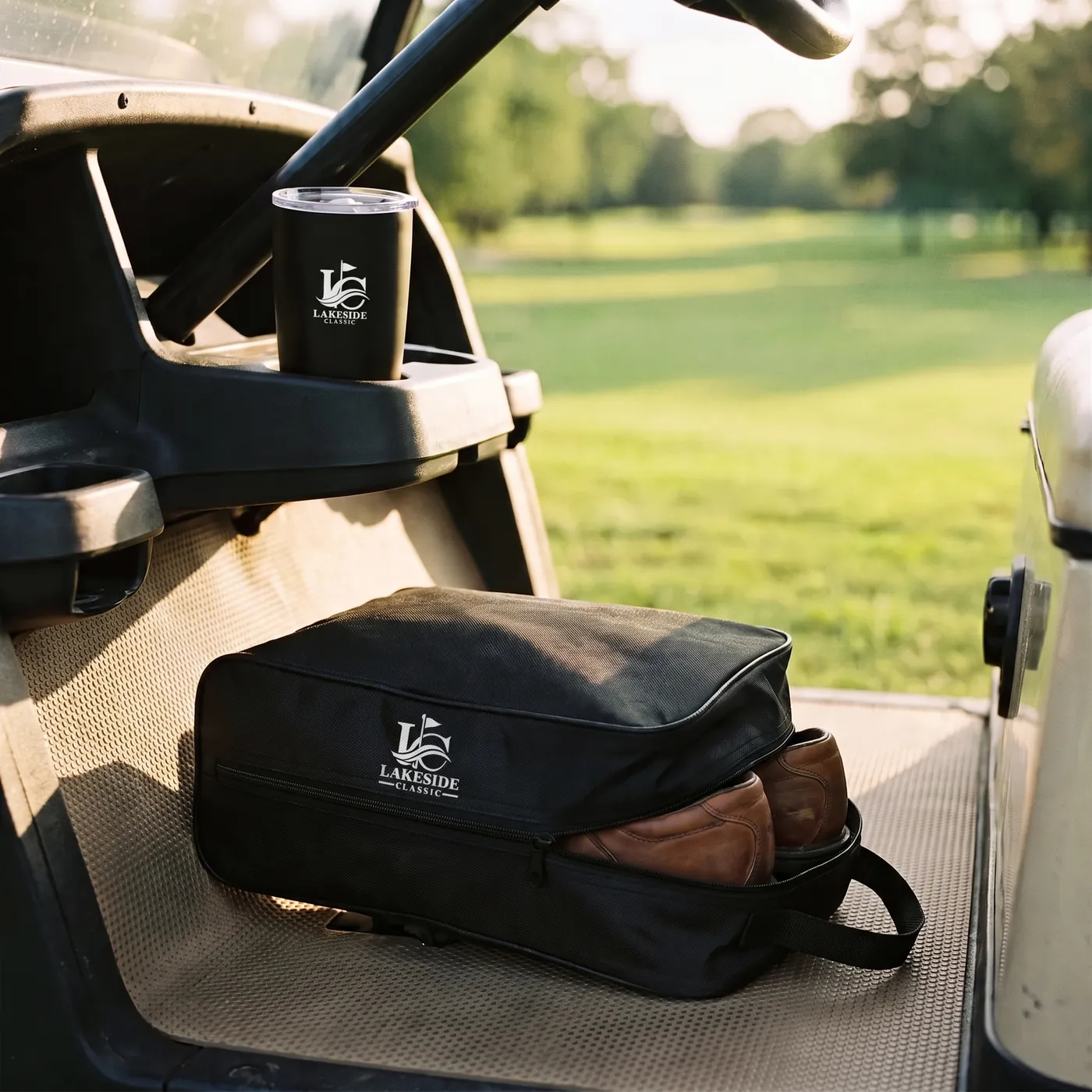 Custom golf shoe bag and travel tumbler on a golf cart