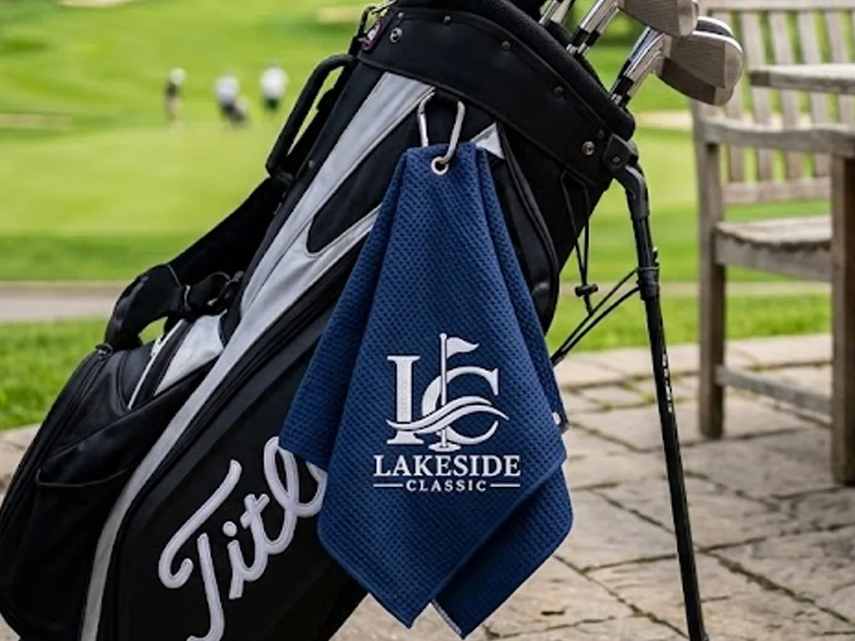 Custom embroidered golf tournament towel on a golf bag