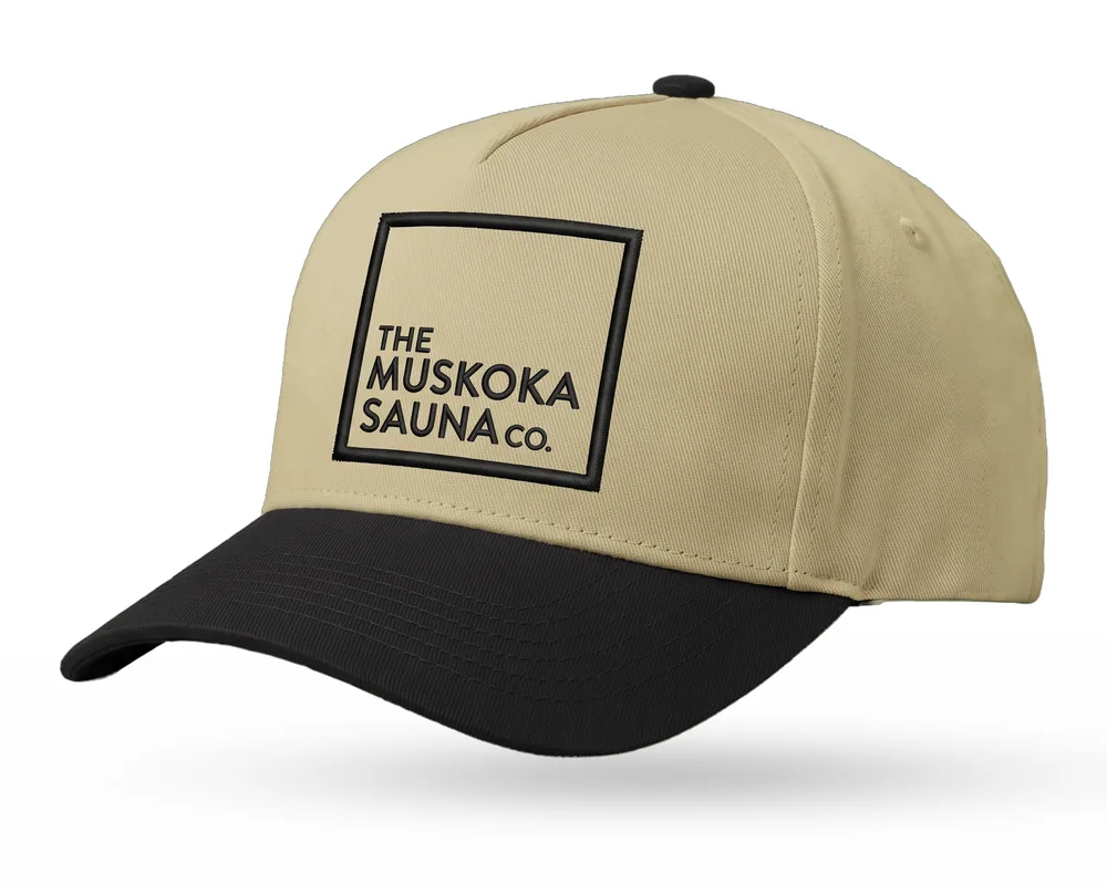 The Muskoka Sauna Co custom 5-panel snapback, sand crown, black brim, black embroidered square logo