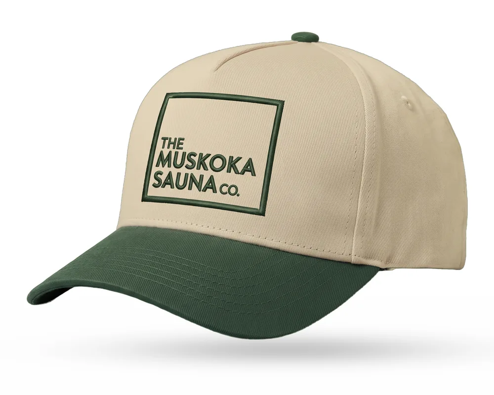 The Muskoka Sauna Co custom 5-panel snapback, sand crown, forest green brim, green embroidered square logo