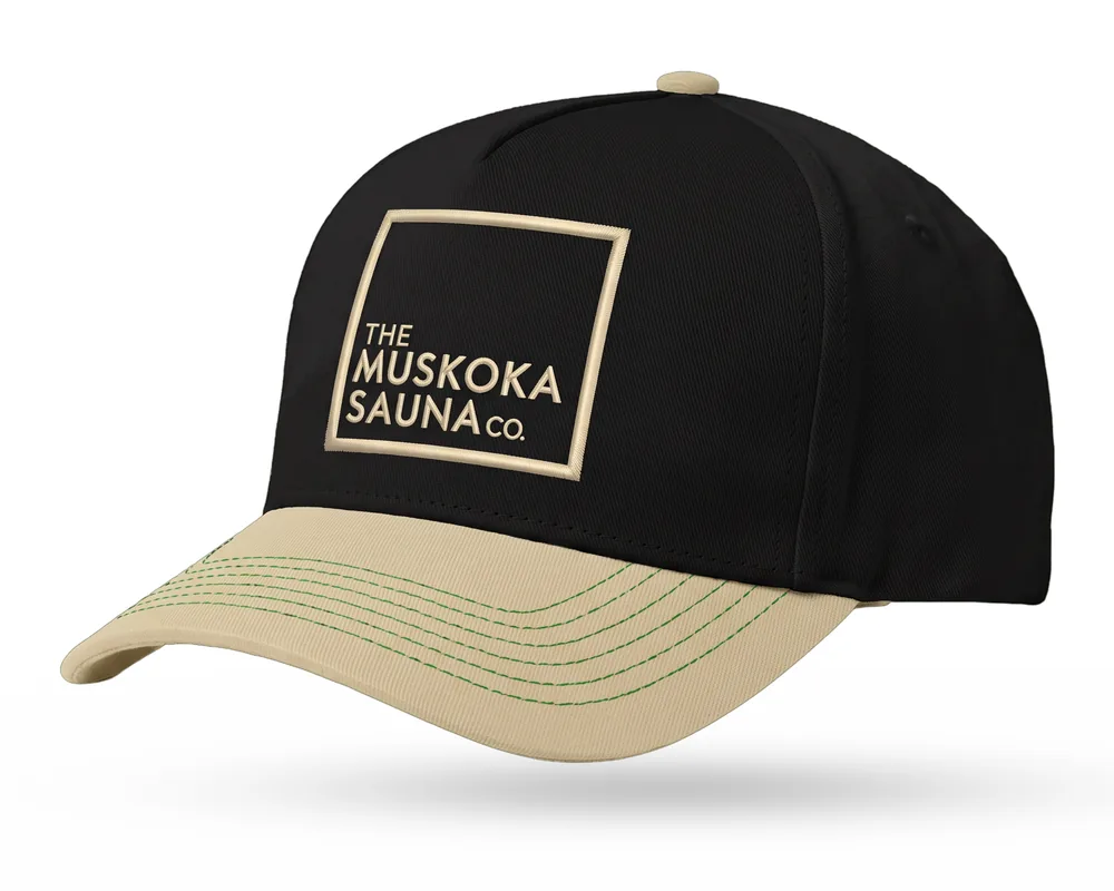 The Muskoka Sauna Co custom 5-panel snapback, black crown, sand brim, sand embroidered square logo