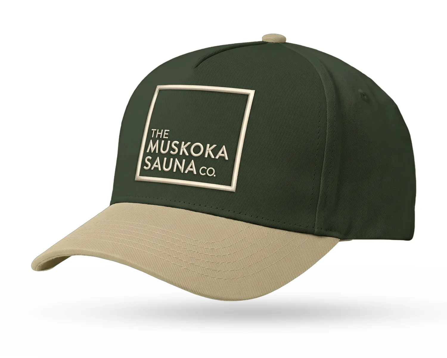 The Muskoka Sauna Co custom 5-panel snapback, forest green crown, sand brim, sand embroidered square logo
