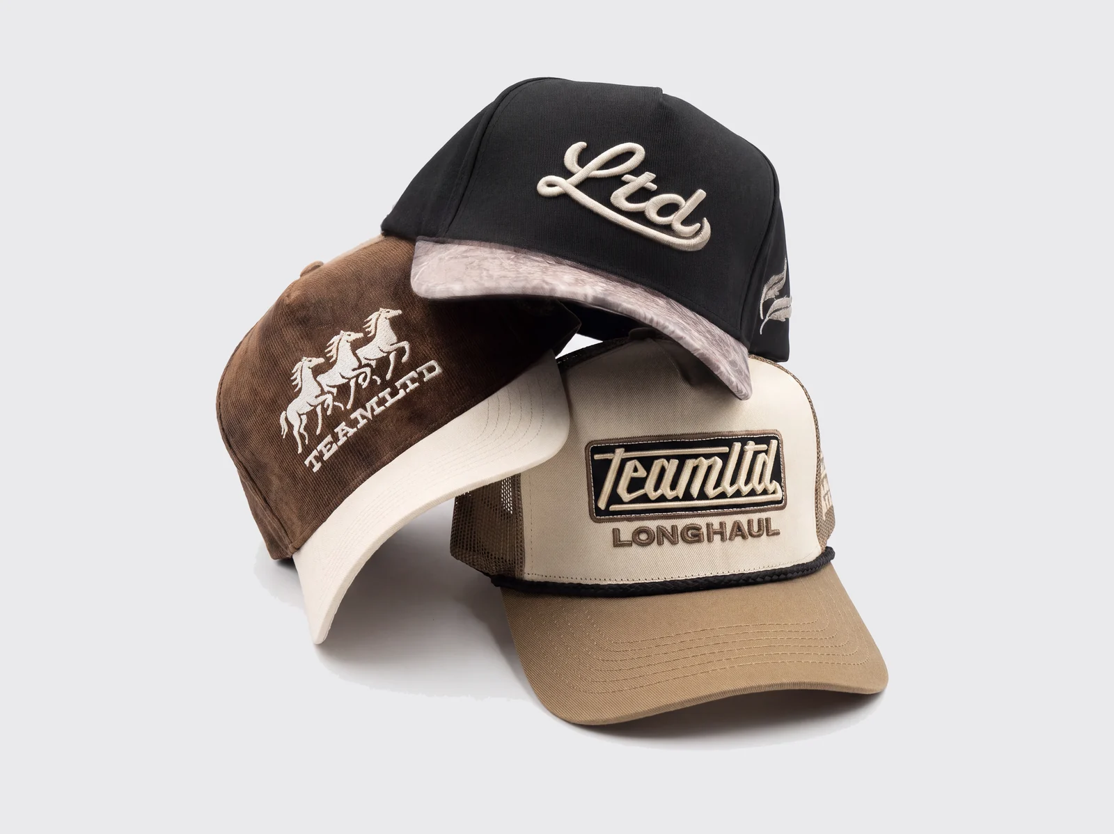 Three TEAMLTD hats including the Longhaul woven patch rope cap
