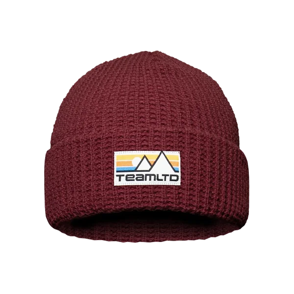 Burgundy waffle-knit toque with a woven mountain label on the cuff